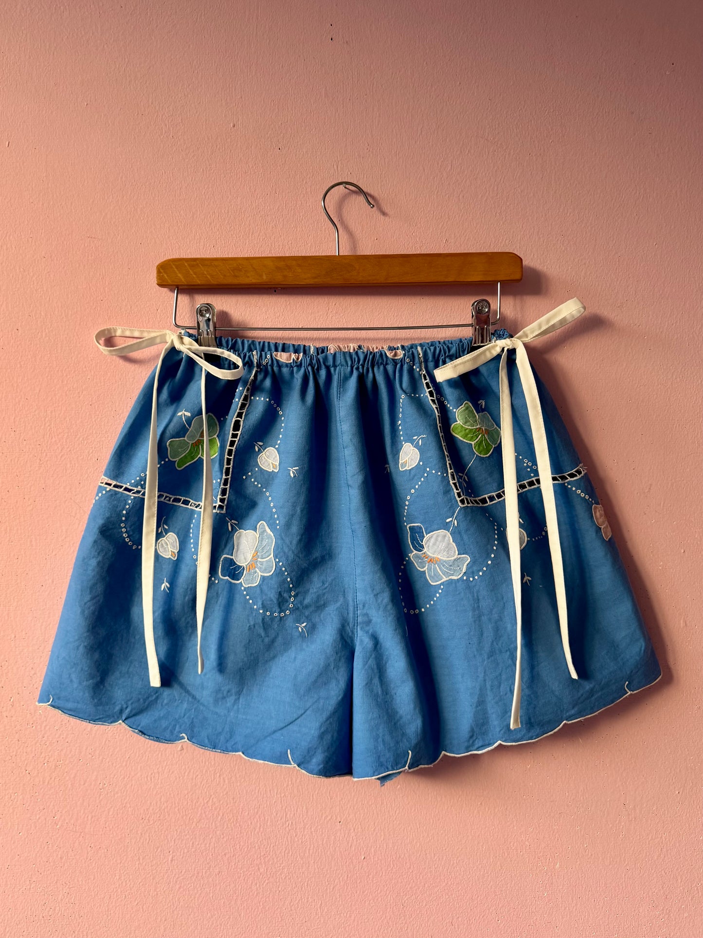 Blue shorts with white bows