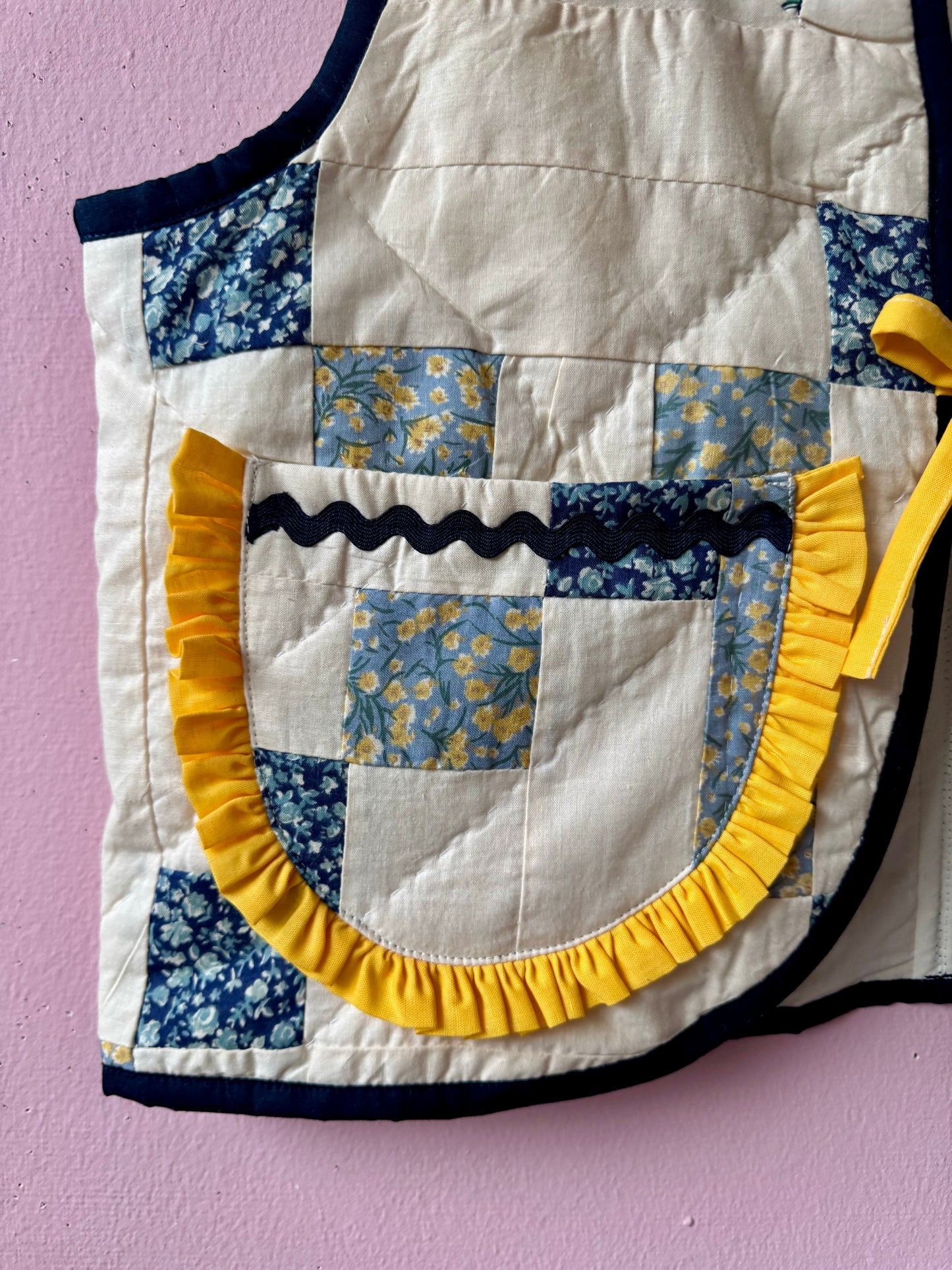 Blue/white vest with yellow trim