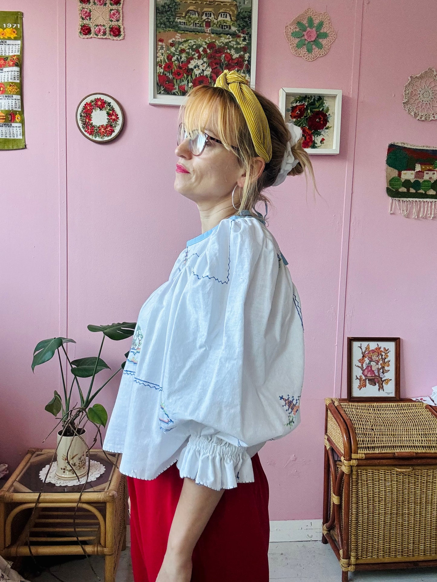 White cotton blouse with cross stitching and frilly sleeves