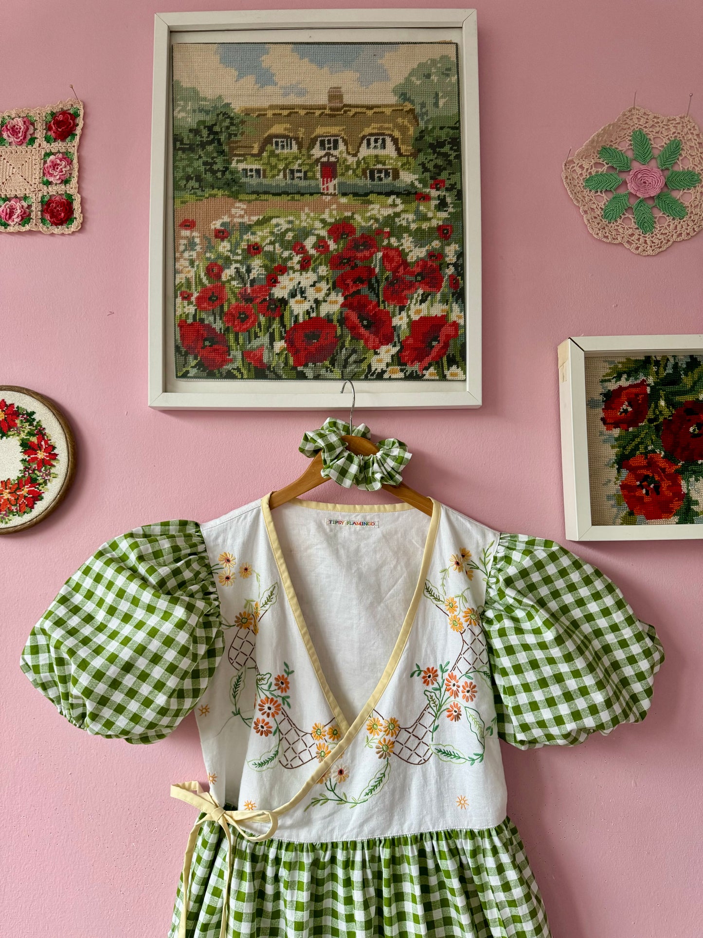 Wrap around dress with green gingham and embroidery