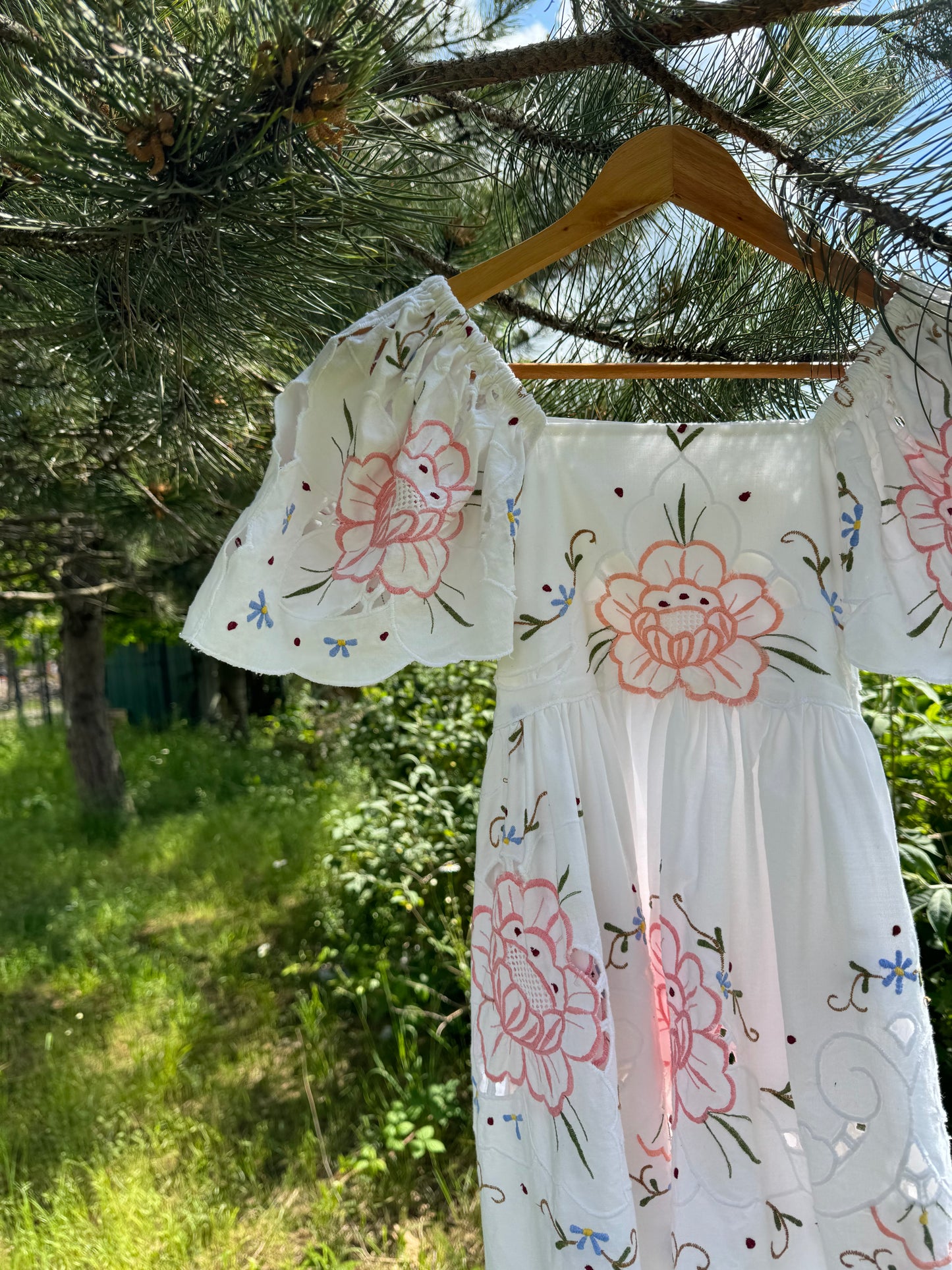 Short dress with floral cut out embroidery