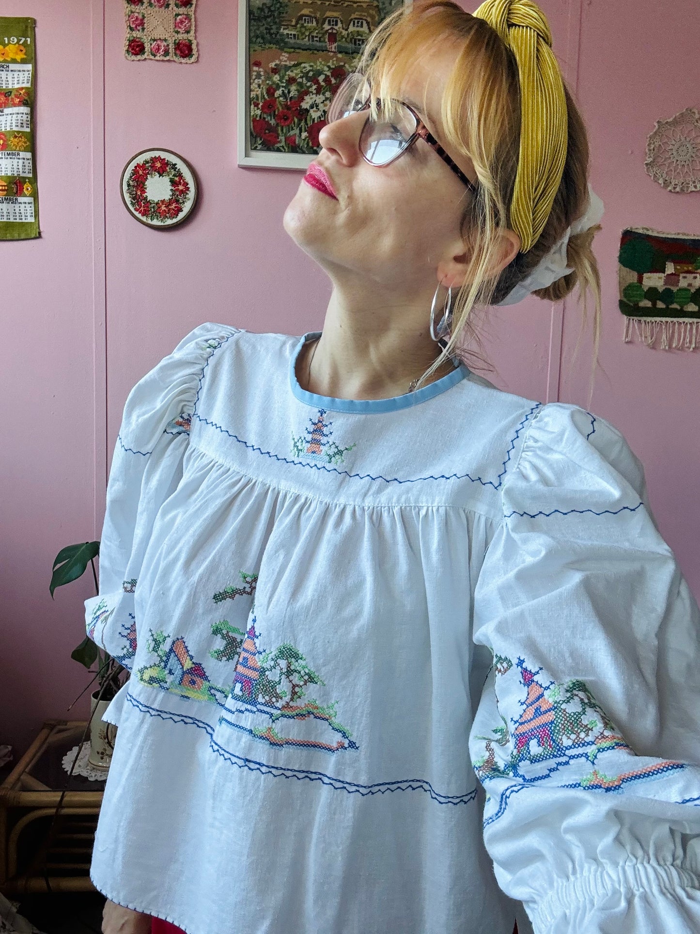 White cotton blouse with cross stitching and frilly sleeves