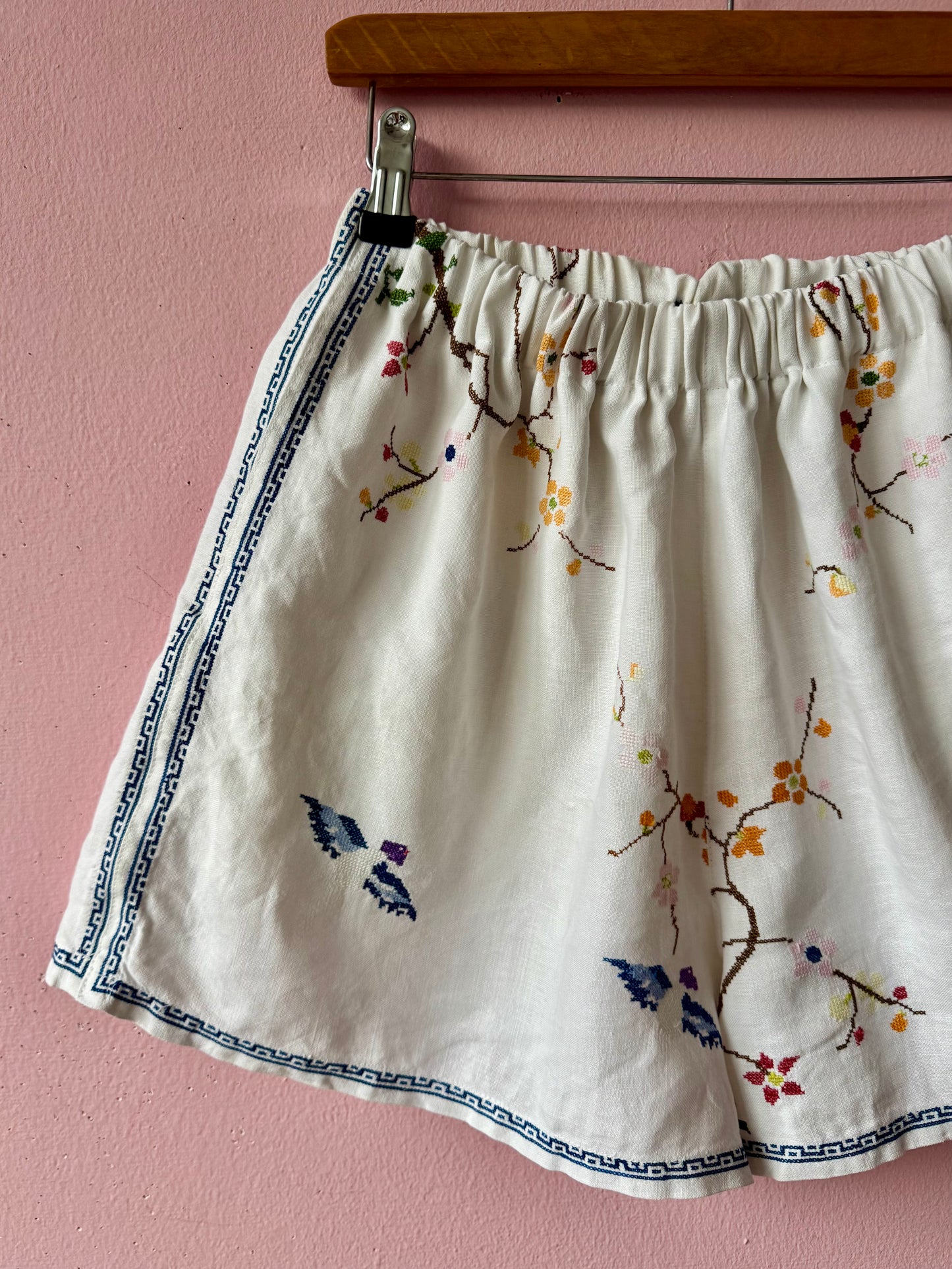Linen shorts with cross stitching embroidery