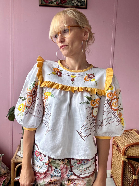 Blouse with hand embroidery and yellow frill
