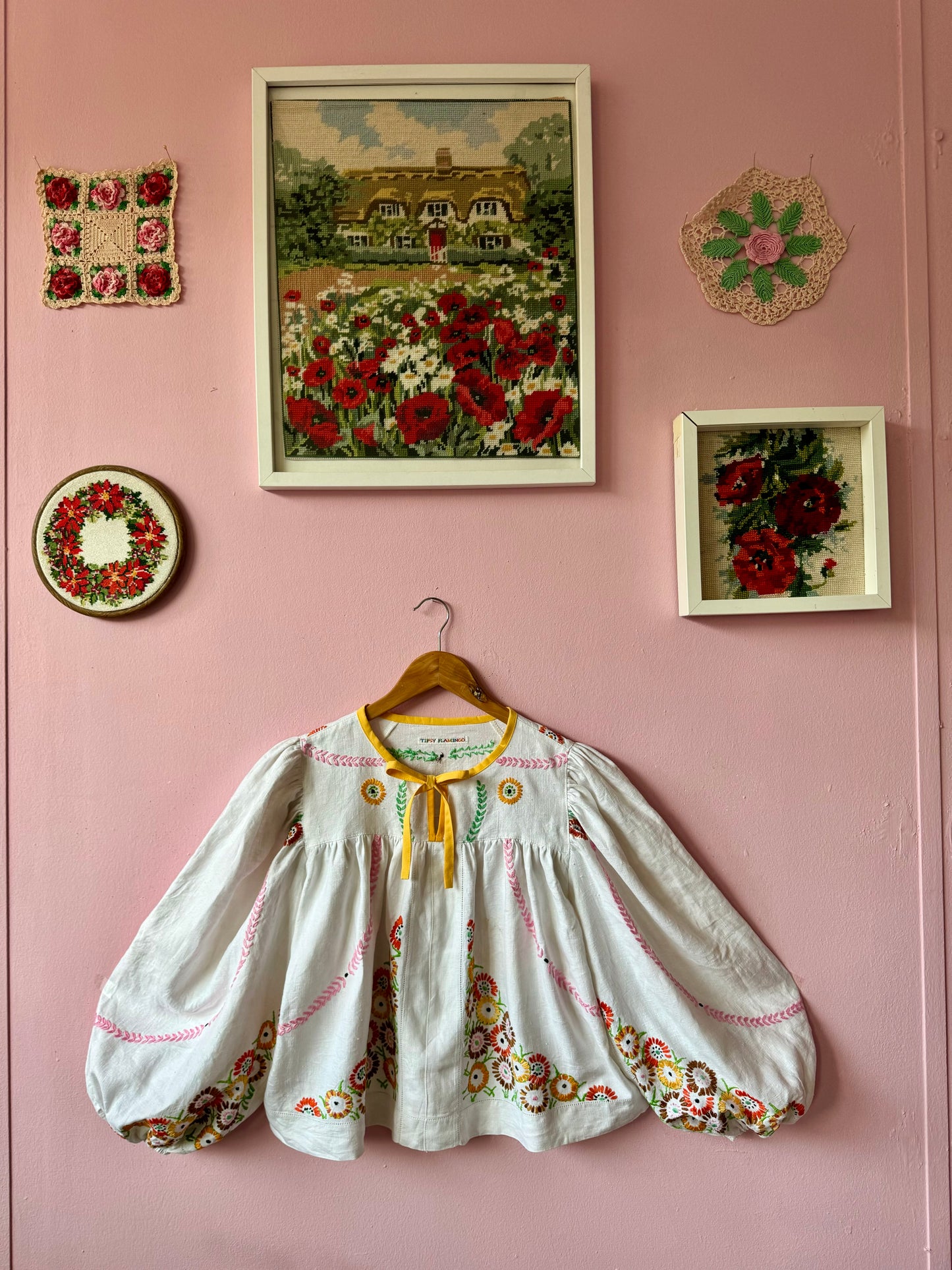 Linen blouse with floral embroidery and yellow binding