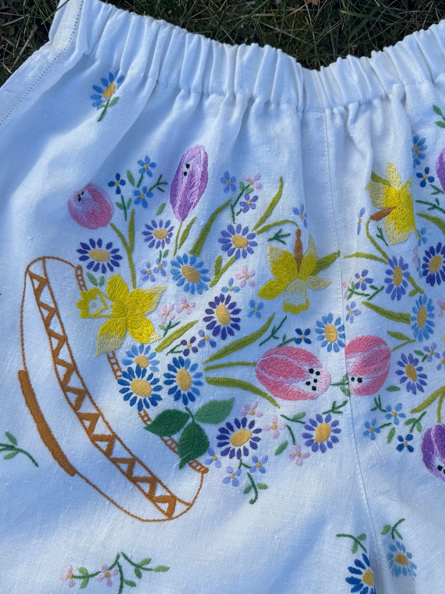 Shorts with floral embroidery and yellow ric rac