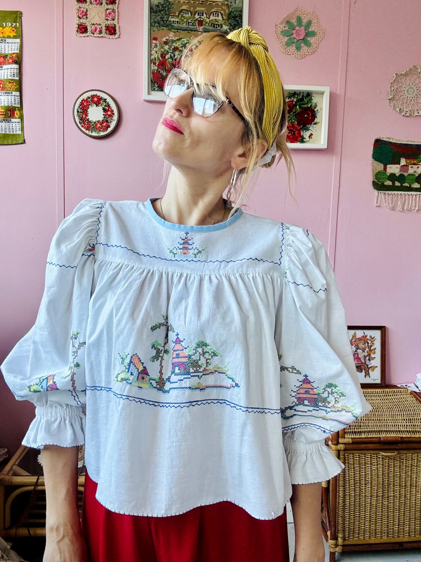 White cotton blouse with cross stitching and frilly sleeves