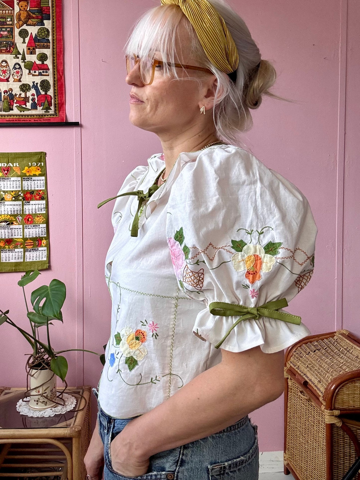 Cream blouse with floral appliqués