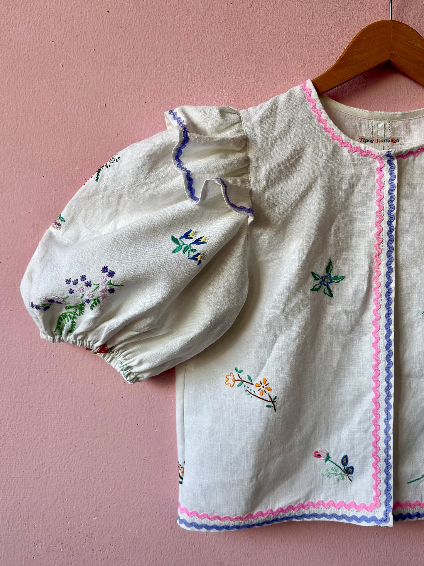 Linen blouse with pink and lilac ric rac