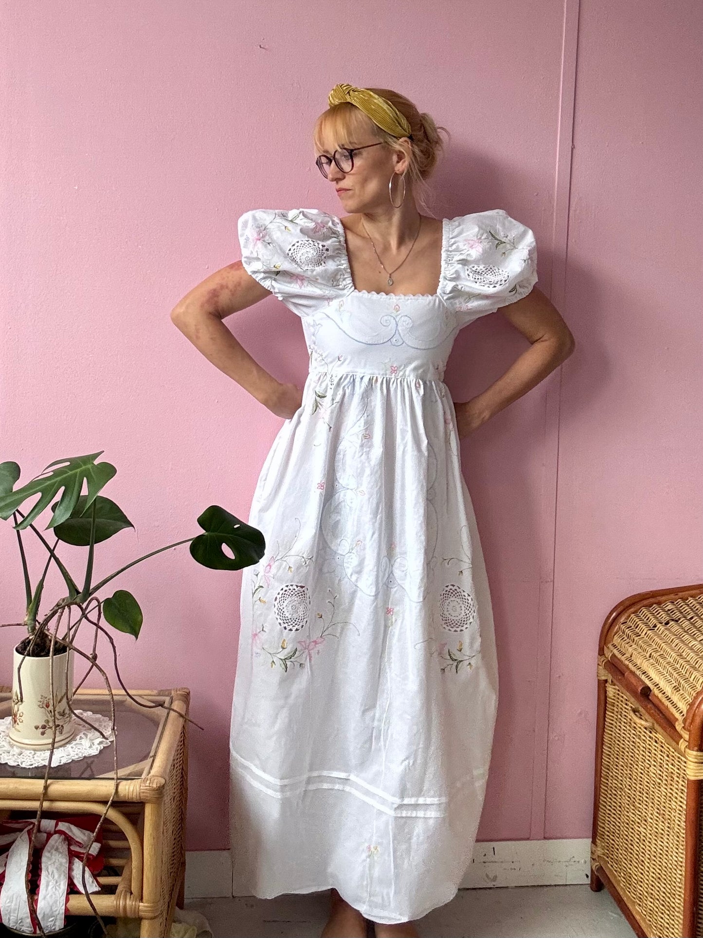 White maxi dress with floral embroidery and puffy sleeves