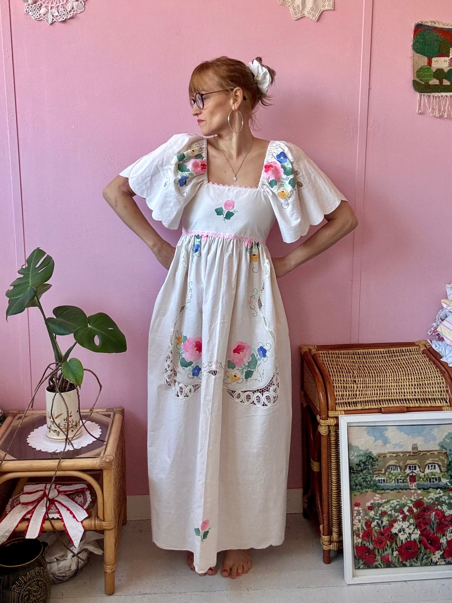 Cream maxi dress with floral appliqués