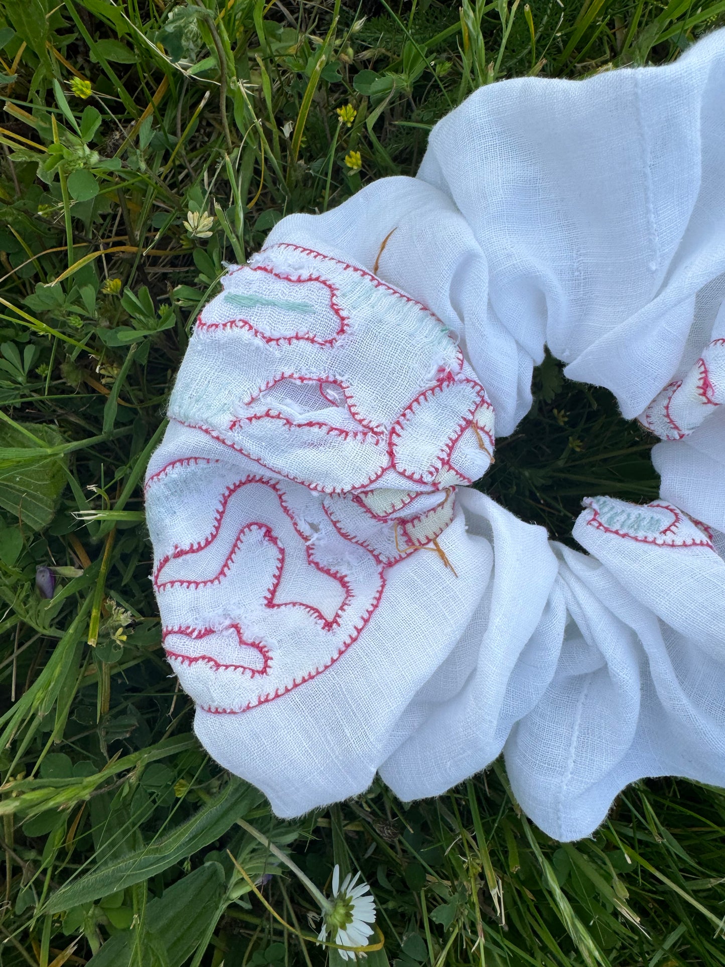 Light linen embroidery with appliqués