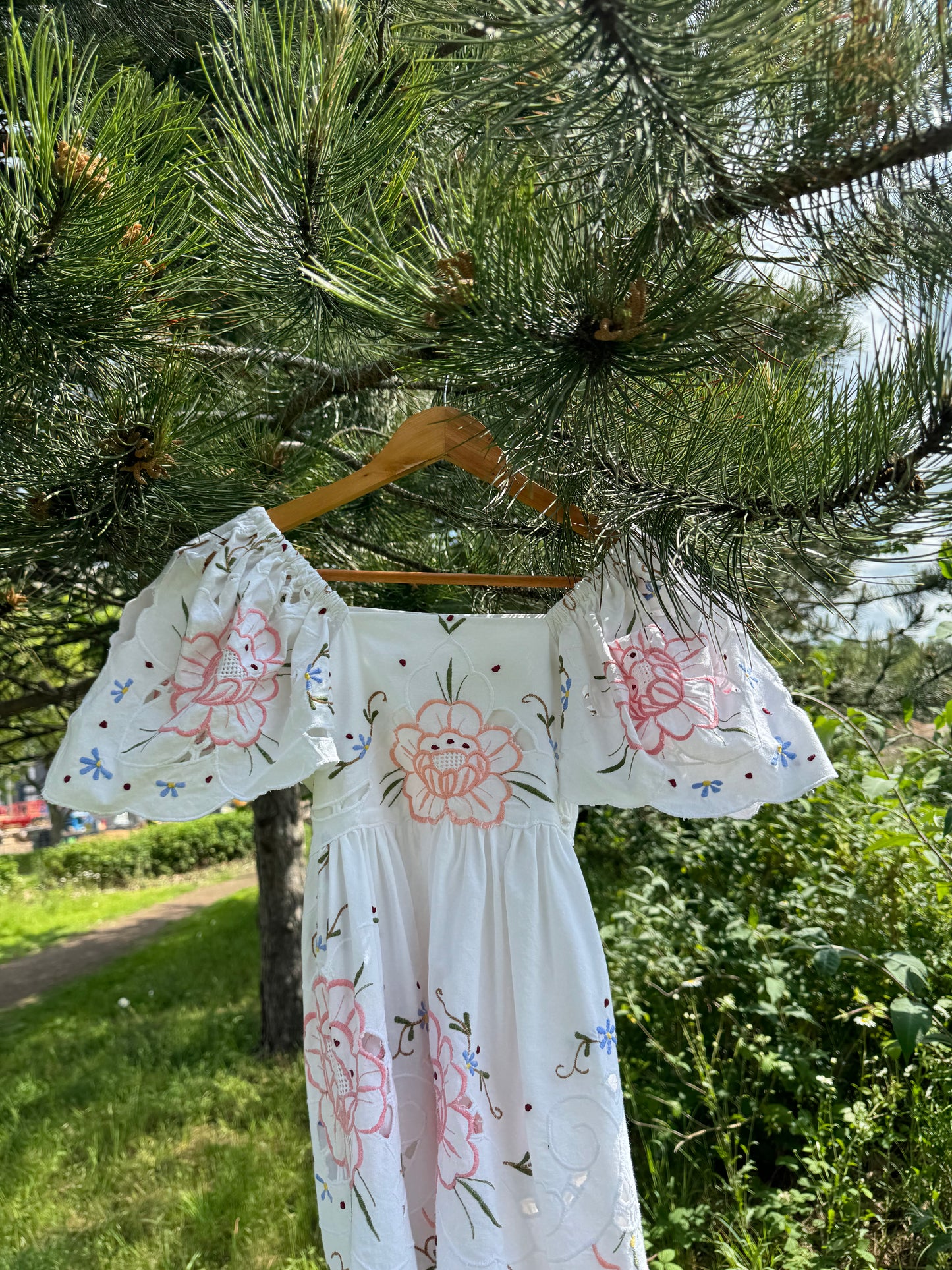Short dress with floral cut out embroidery