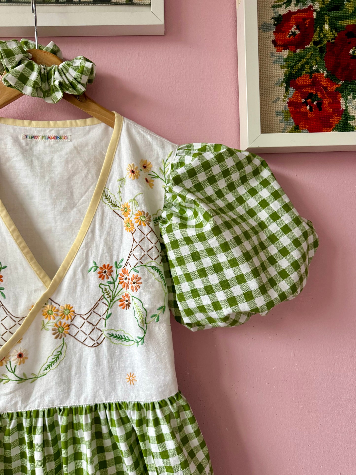 Wrap around dress with green gingham and embroidery