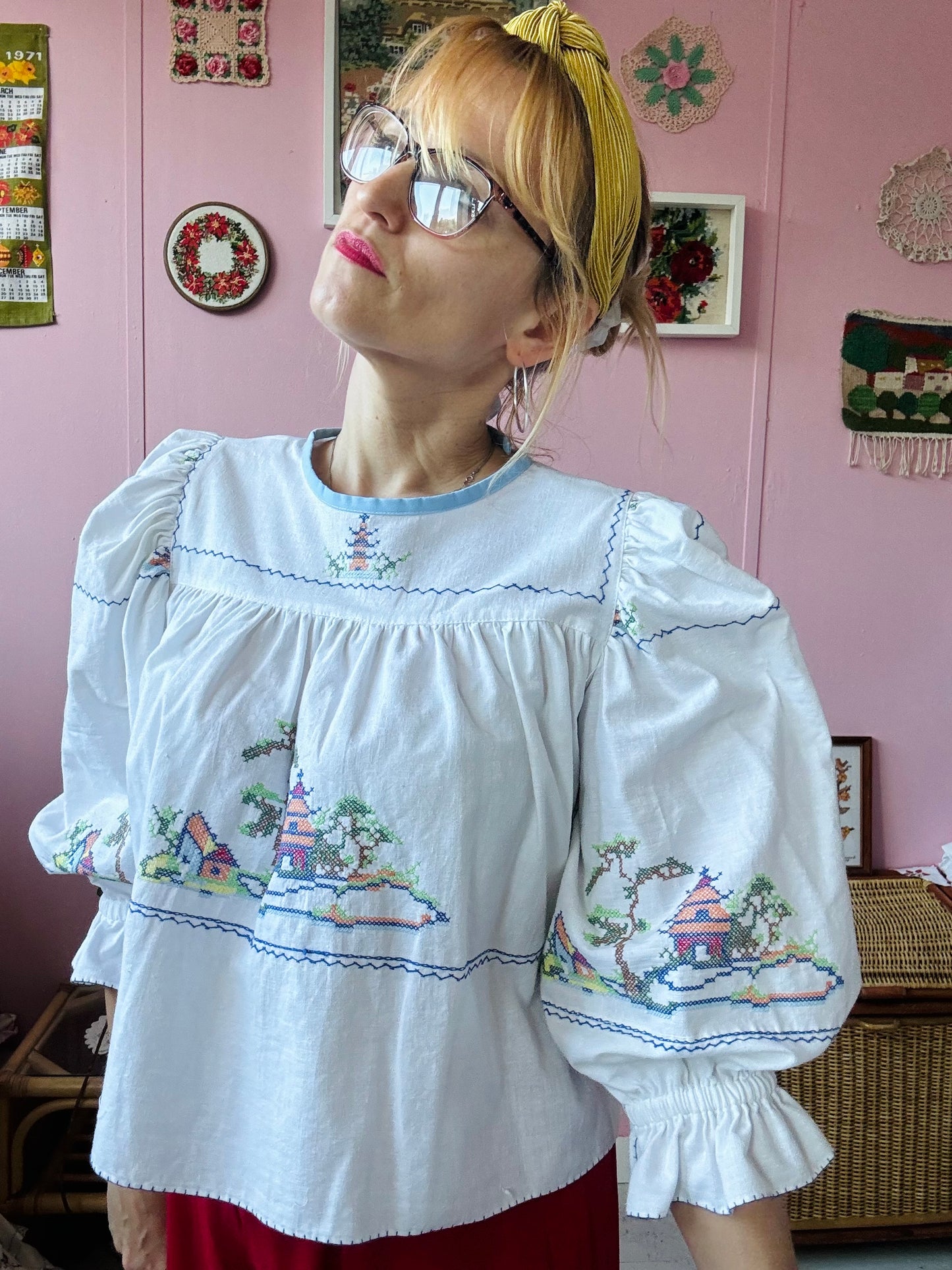 White cotton blouse with cross stitching and frilly sleeves