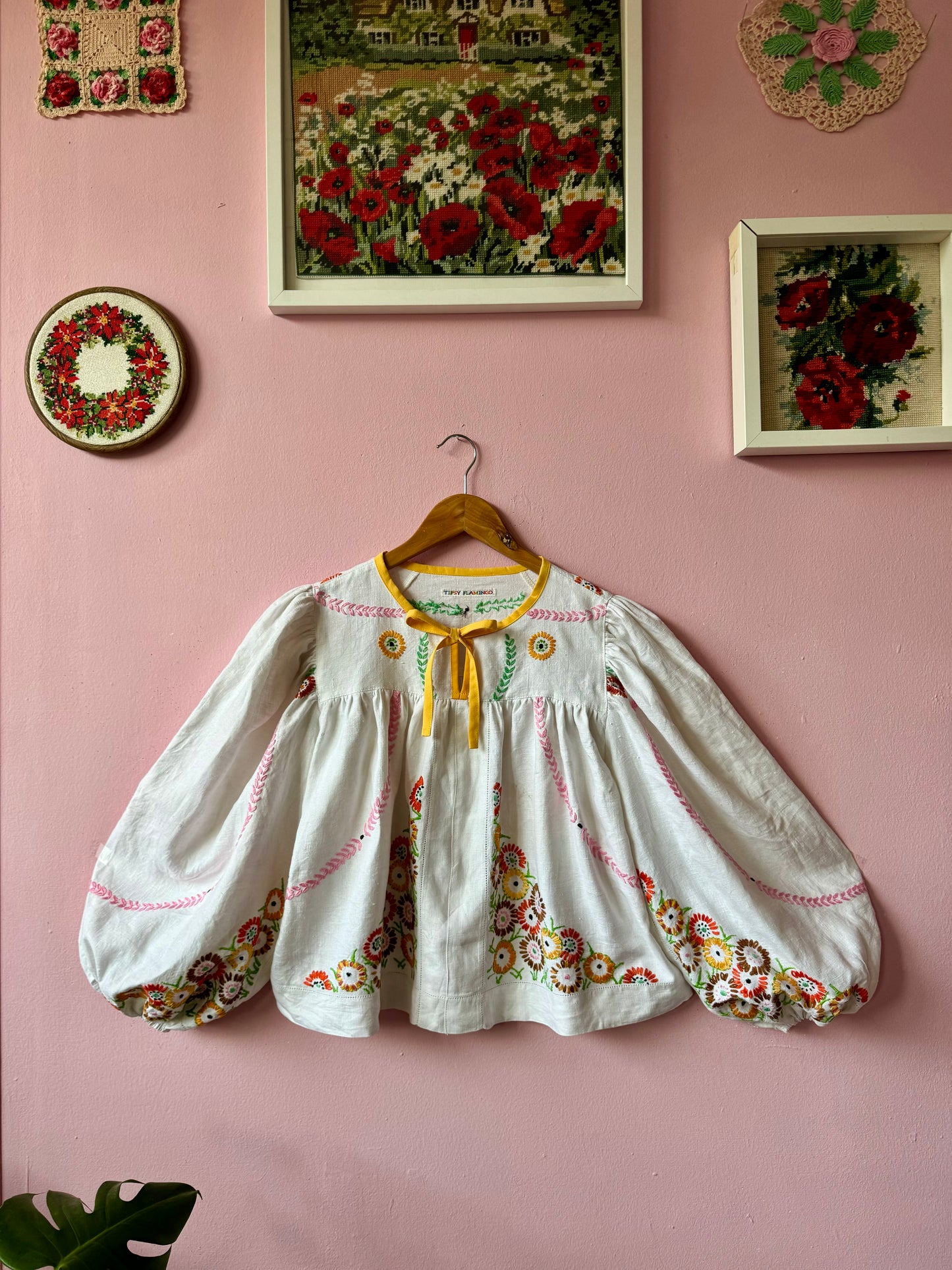 Linen blouse with floral embroidery and yellow binding