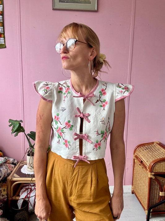 Floral blouse with pink binding and bows