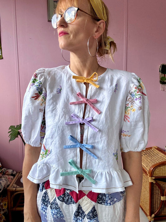 Floral blouse with pastel bows