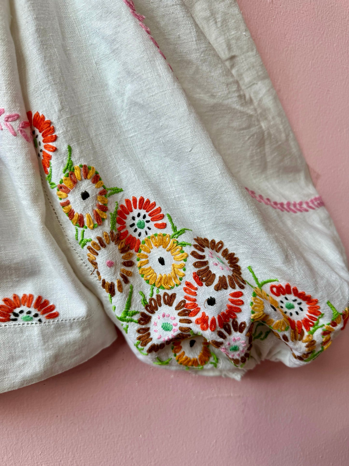 Linen blouse with floral embroidery and yellow binding
