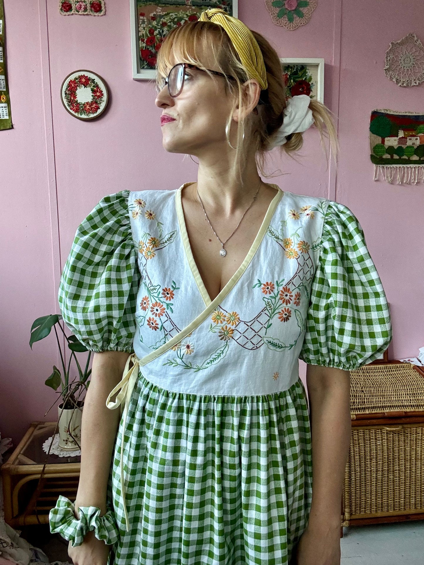 Wrap around dress with green gingham and embroidery