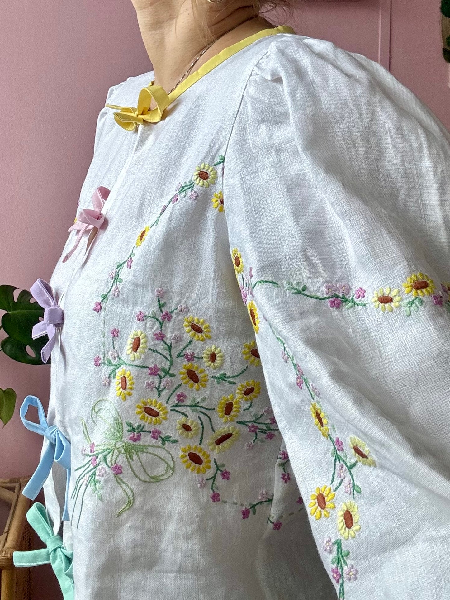 Linen blouse with yellow floral embroidery and rainbow bows