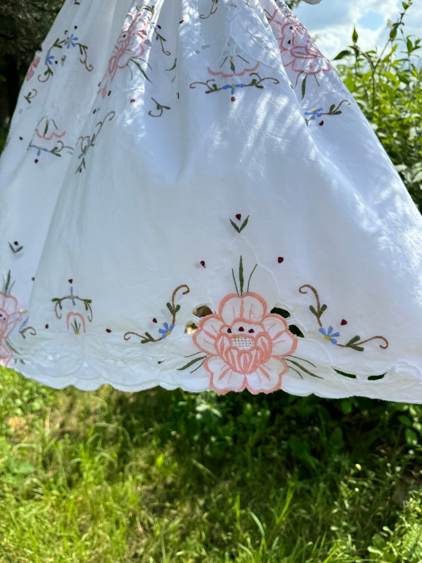 Short dress with floral cut out embroidery