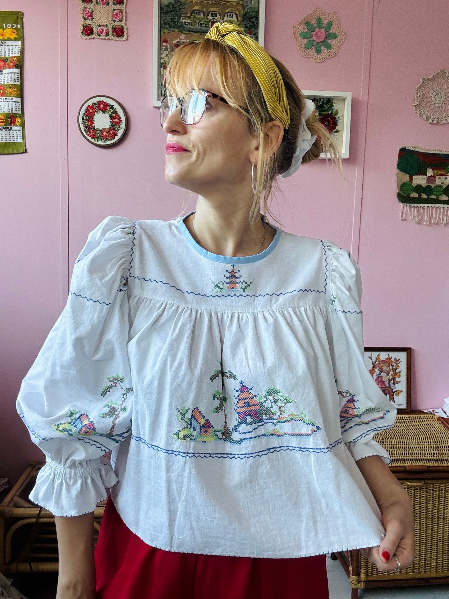 White cotton blouse with cross stitching and frilly sleeves