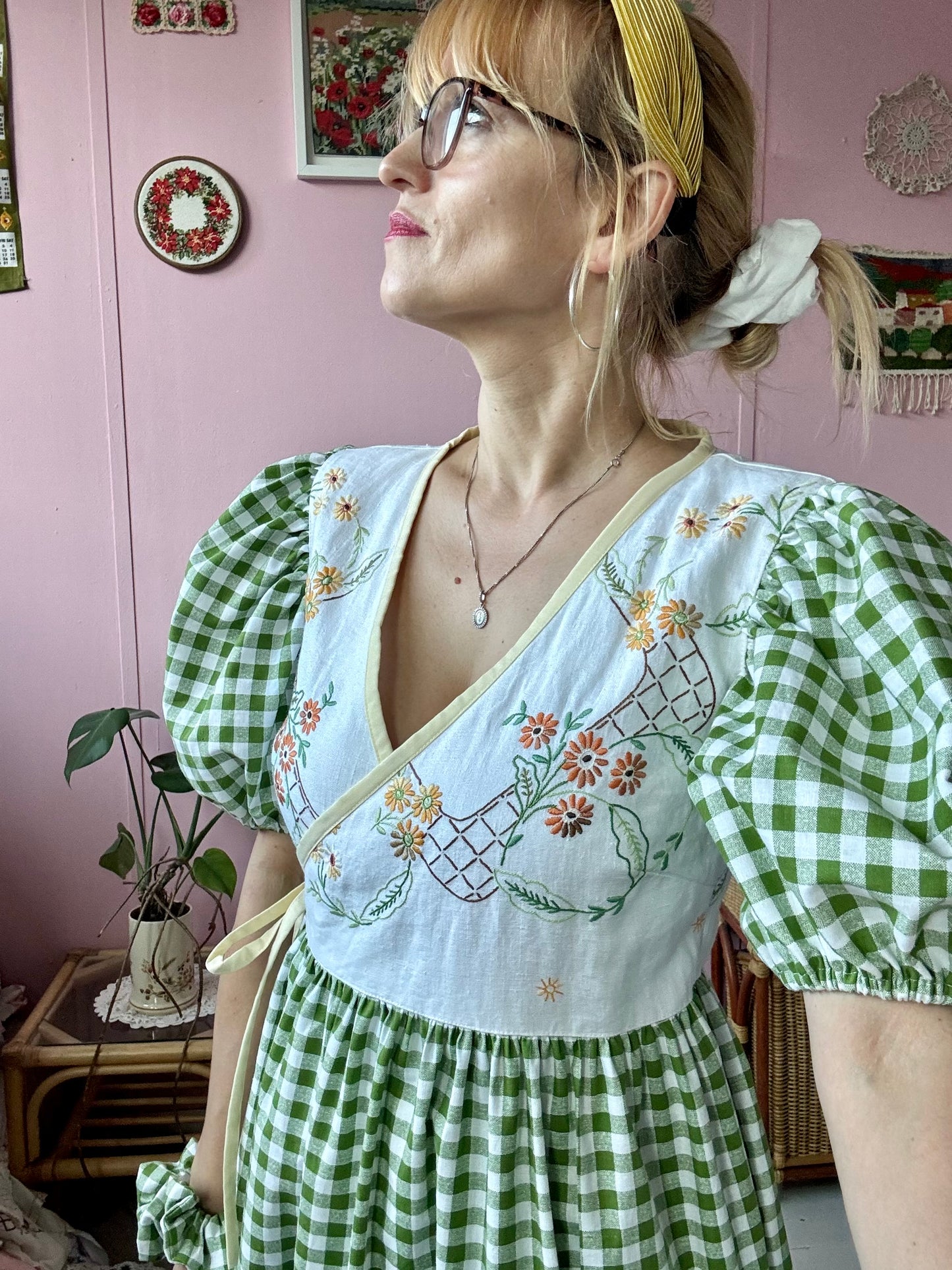 Wrap around dress with green gingham and embroidery