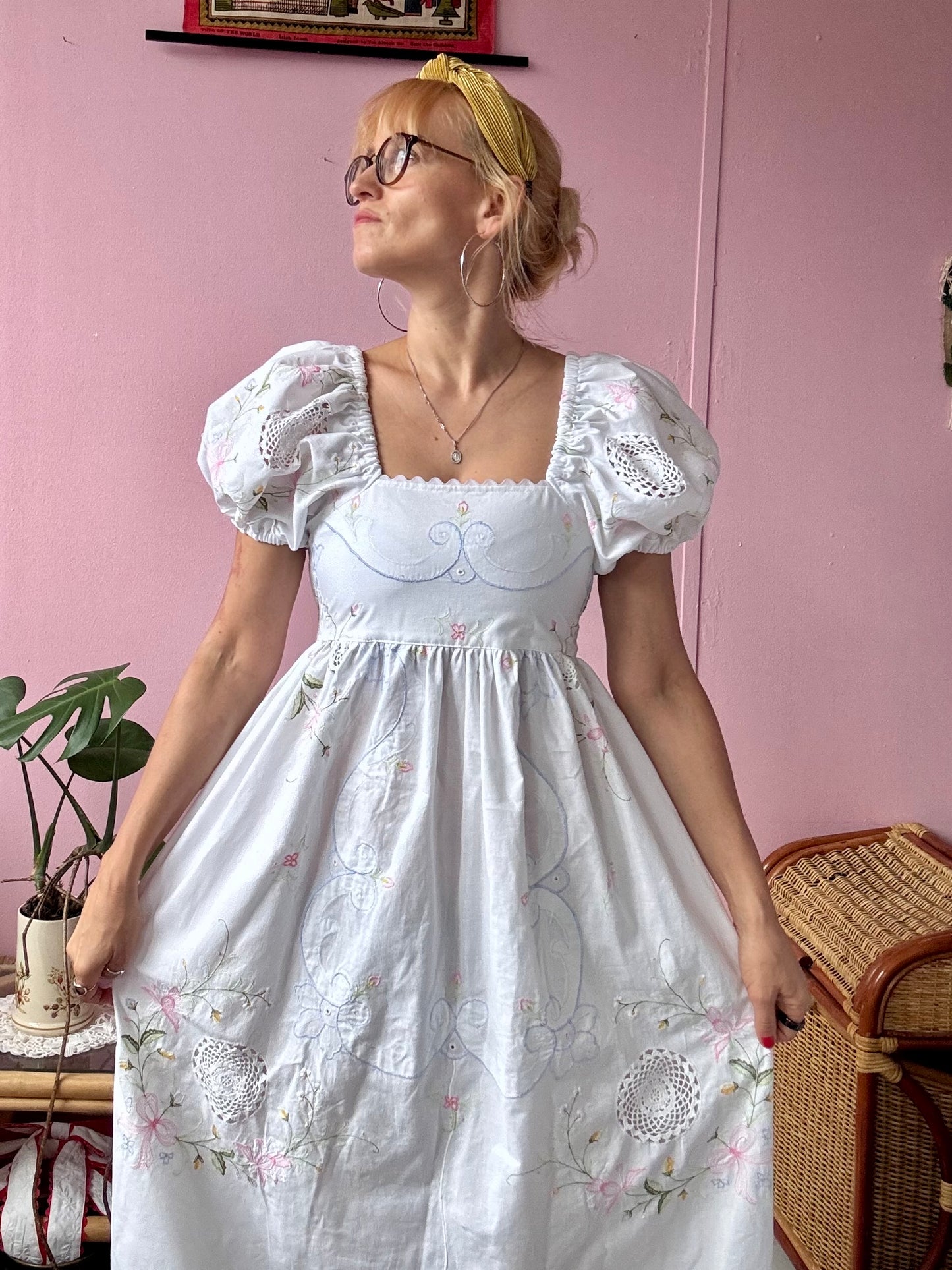 White maxi dress with floral embroidery and puffy sleeves