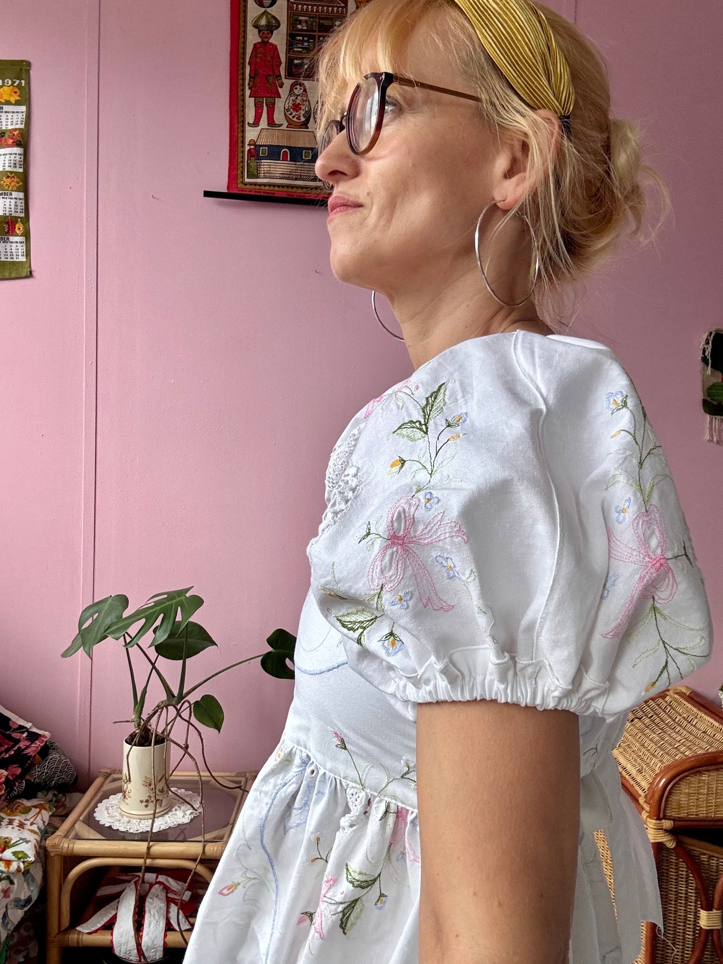 White maxi dress with floral embroidery and puffy sleeves