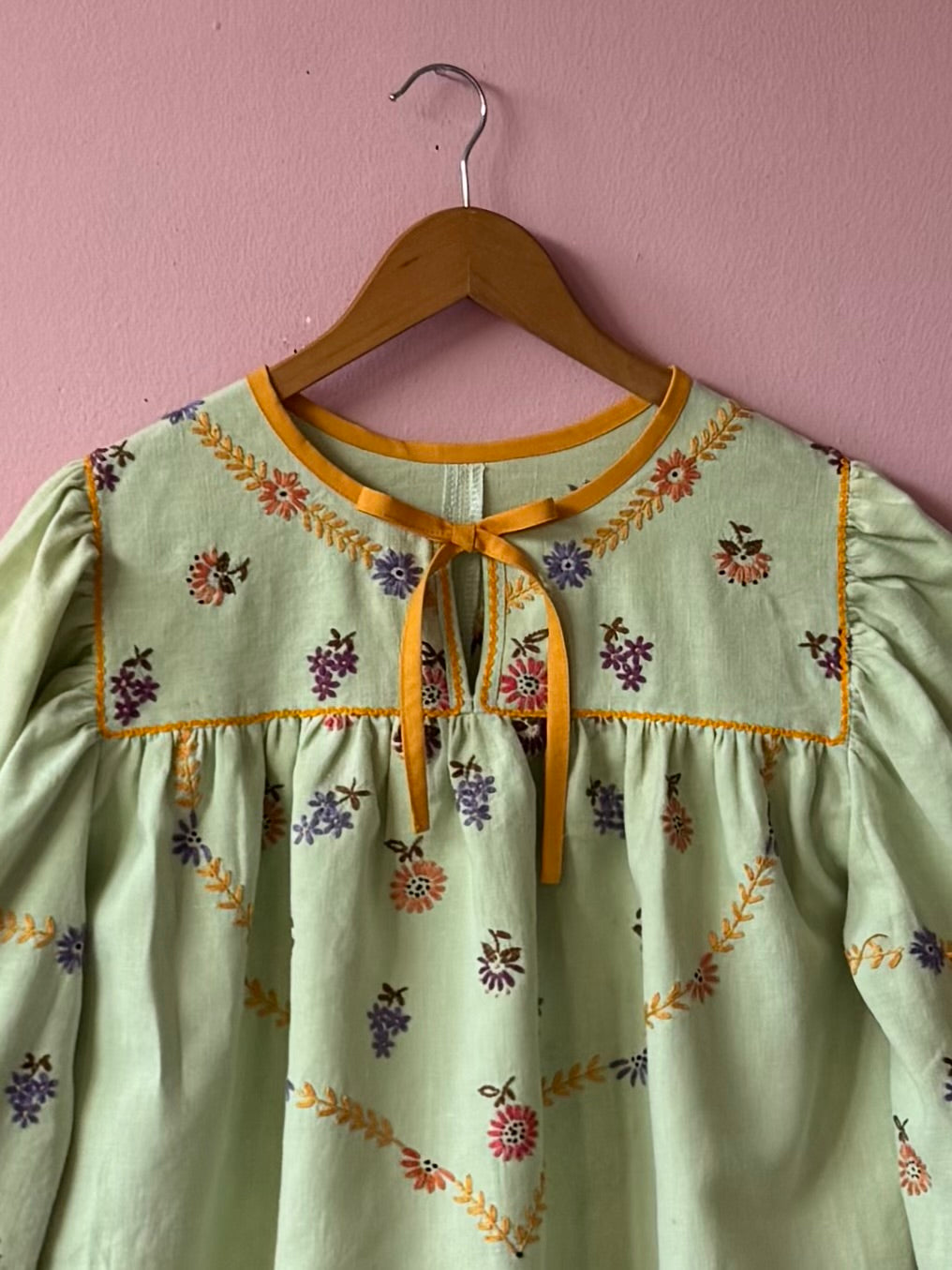 Green blouse with mustard yellow details