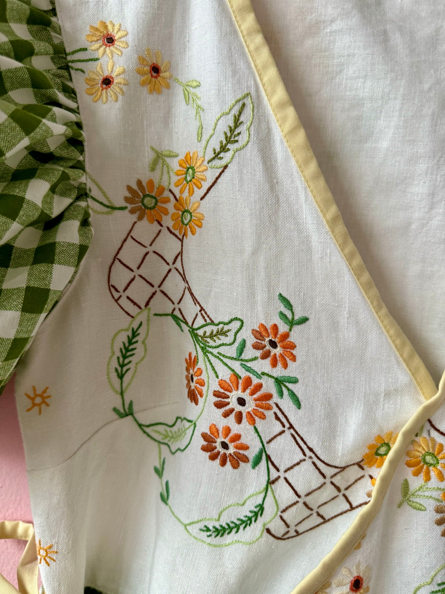 Wrap around dress with green gingham and embroidery