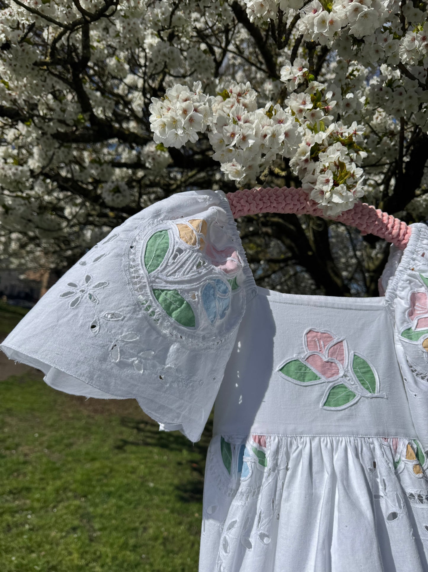 White maxi with pastel embroidery and cut out embroidery