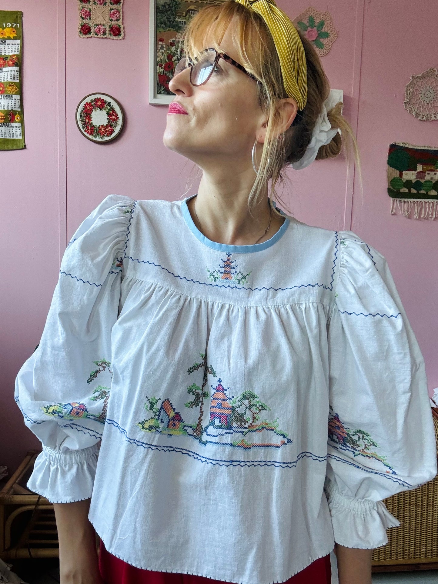 White cotton blouse with cross stitching and frilly sleeves