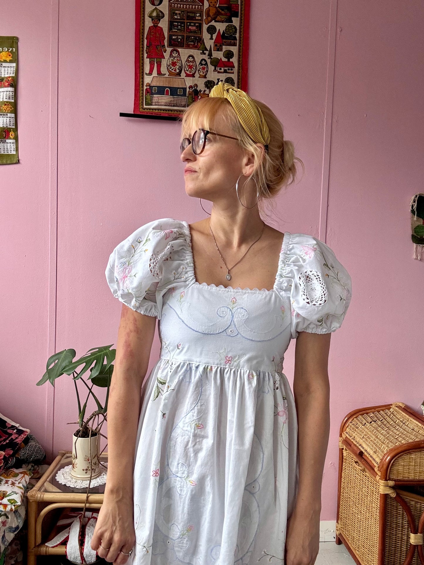 White maxi dress with floral embroidery and puffy sleeves