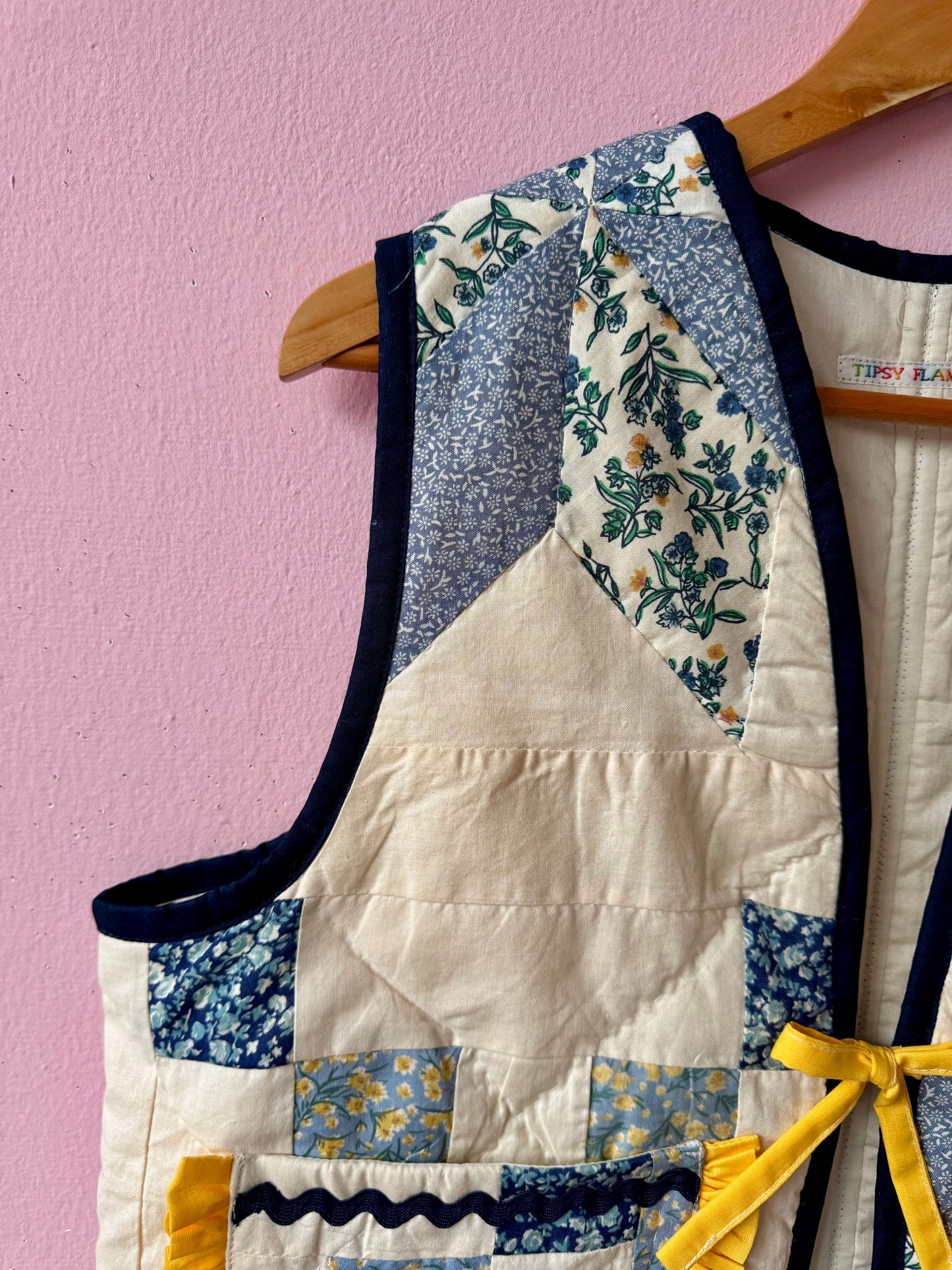 Blue/white vest with yellow trim
