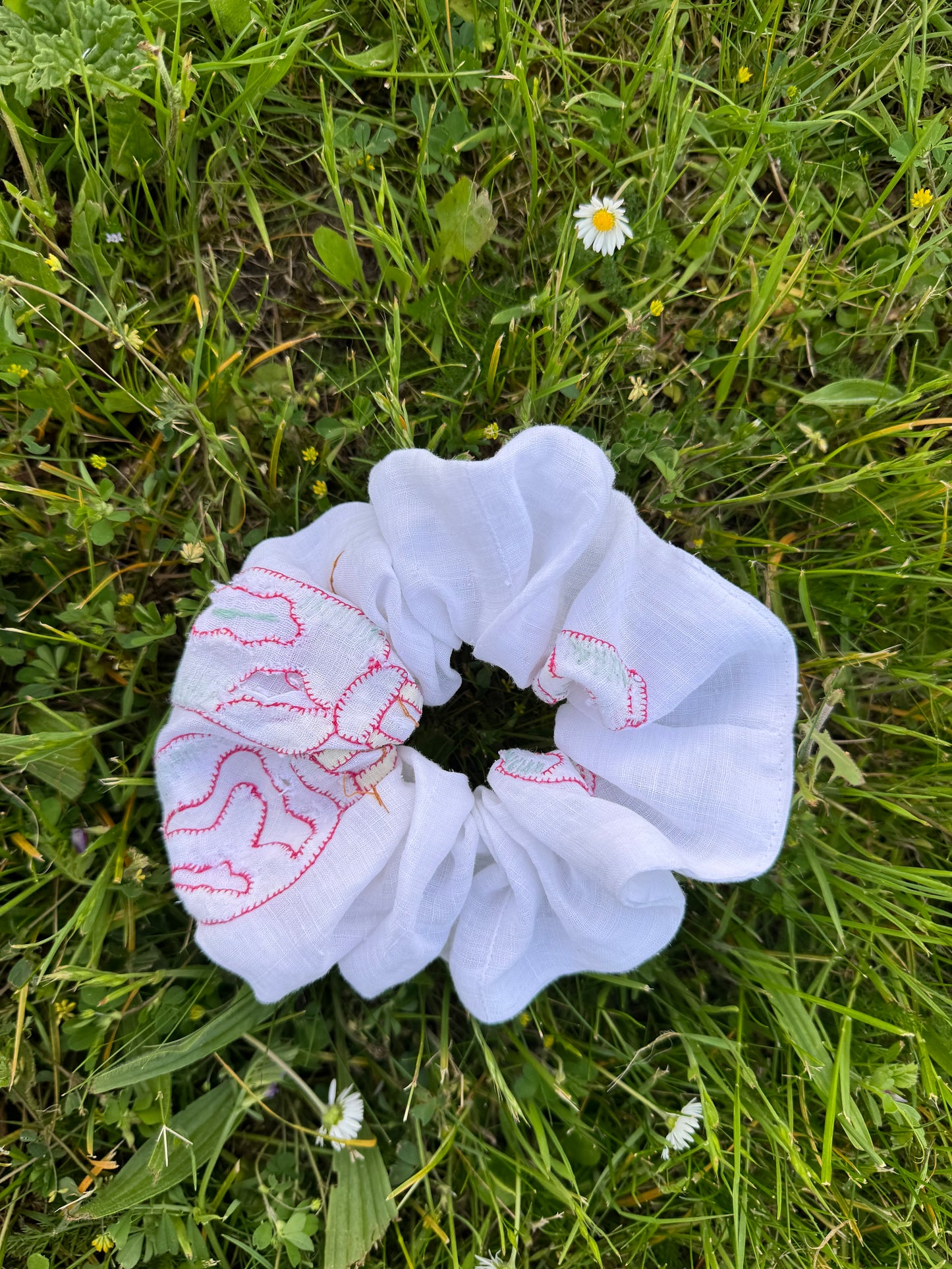 Light linen embroidery with appliqués