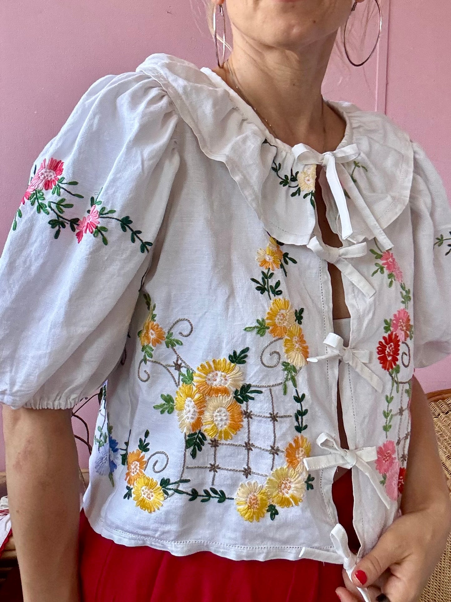 White floral blouse with neckline frill
