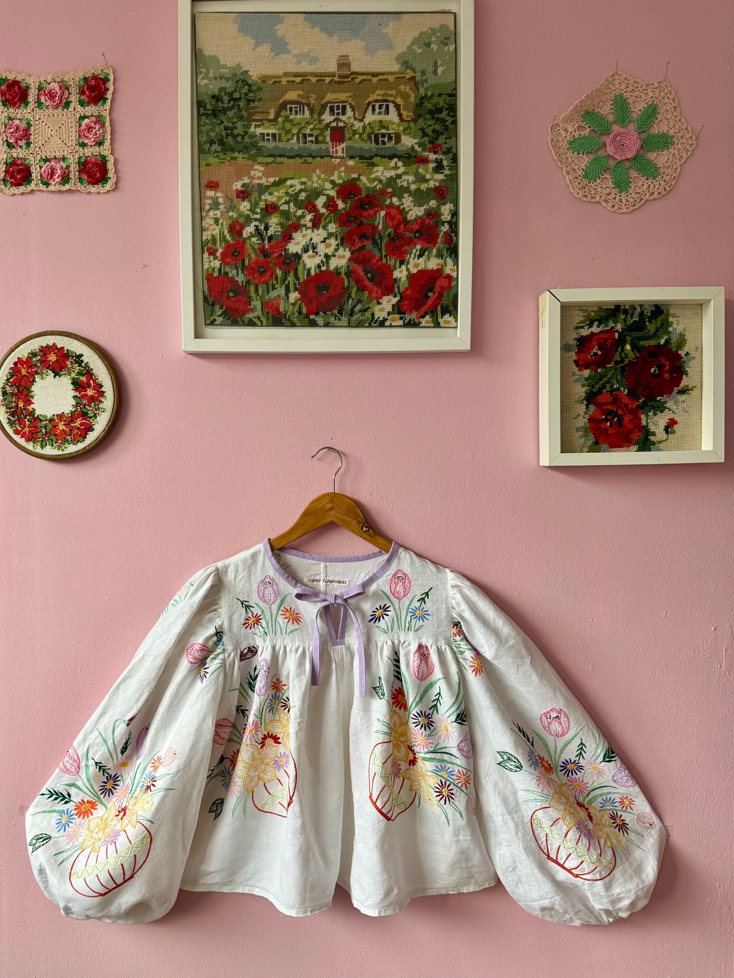 White linen blouse with baskets embroidery and lilac binding