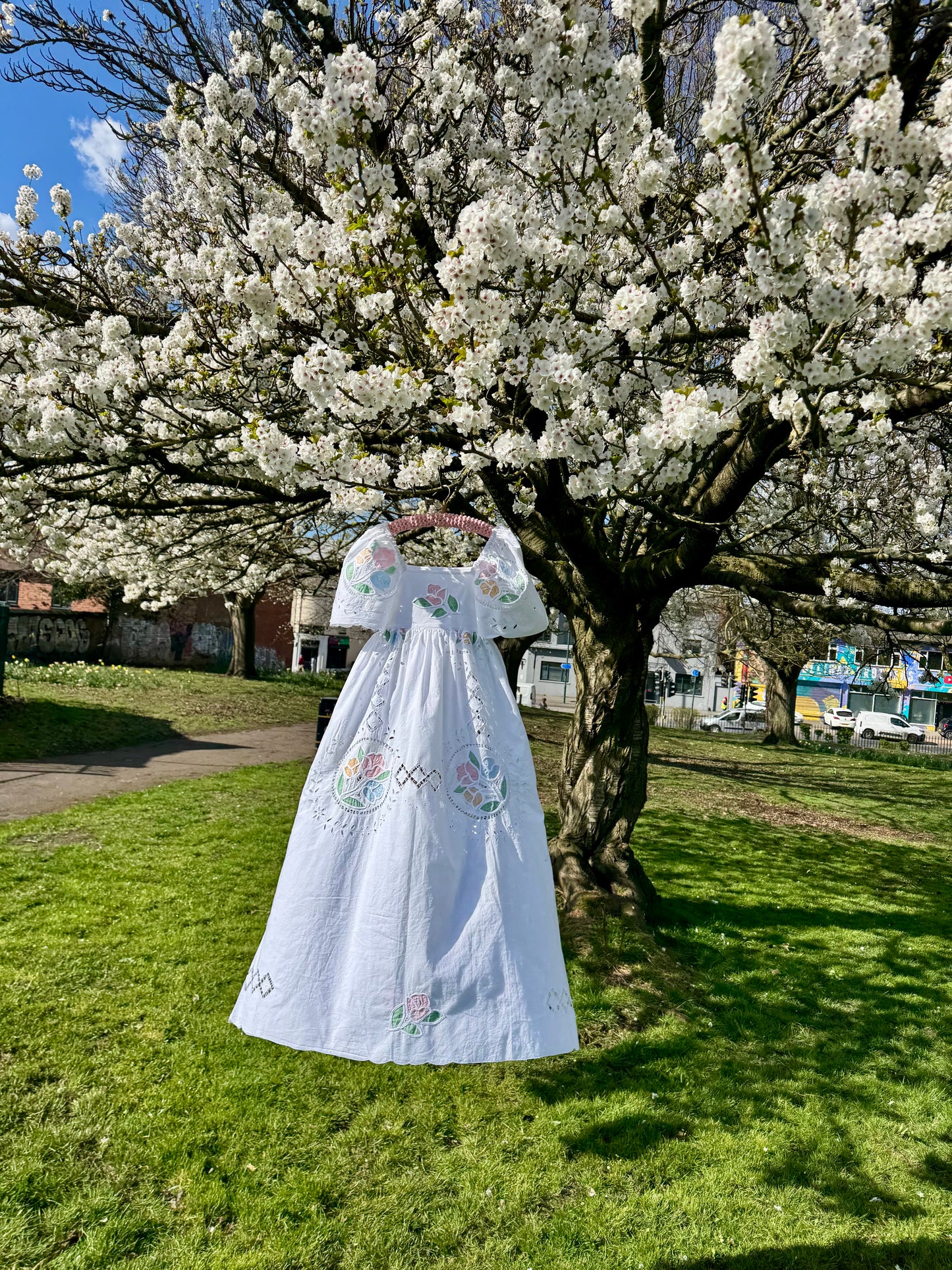White maxi with pastel embroidery and cut out embroidery