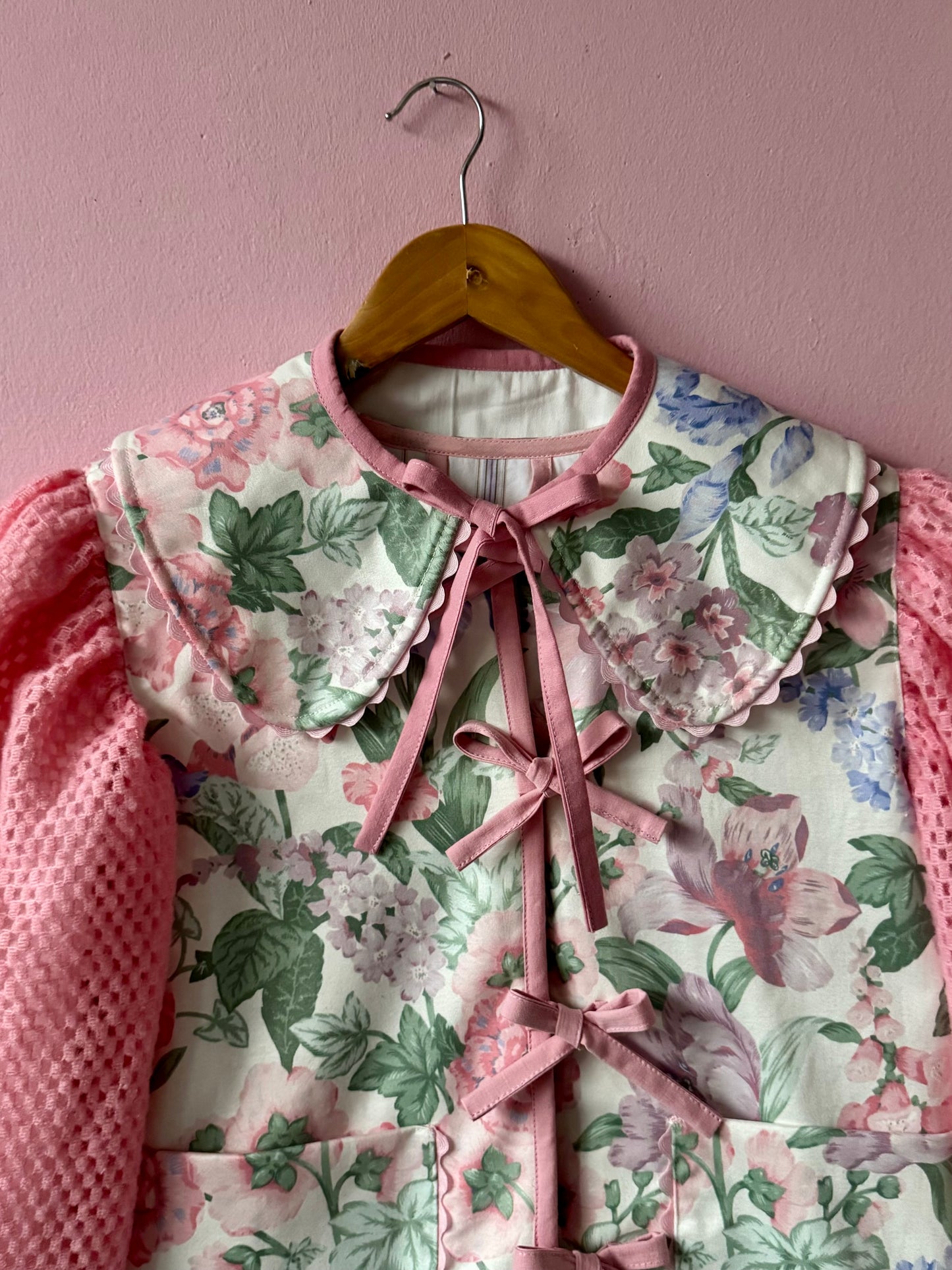 Floral jacket with pink sleeves