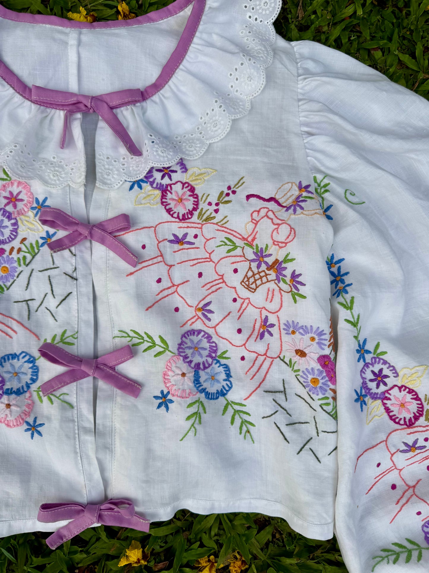 Blouse with lace neckline and lilac trimming