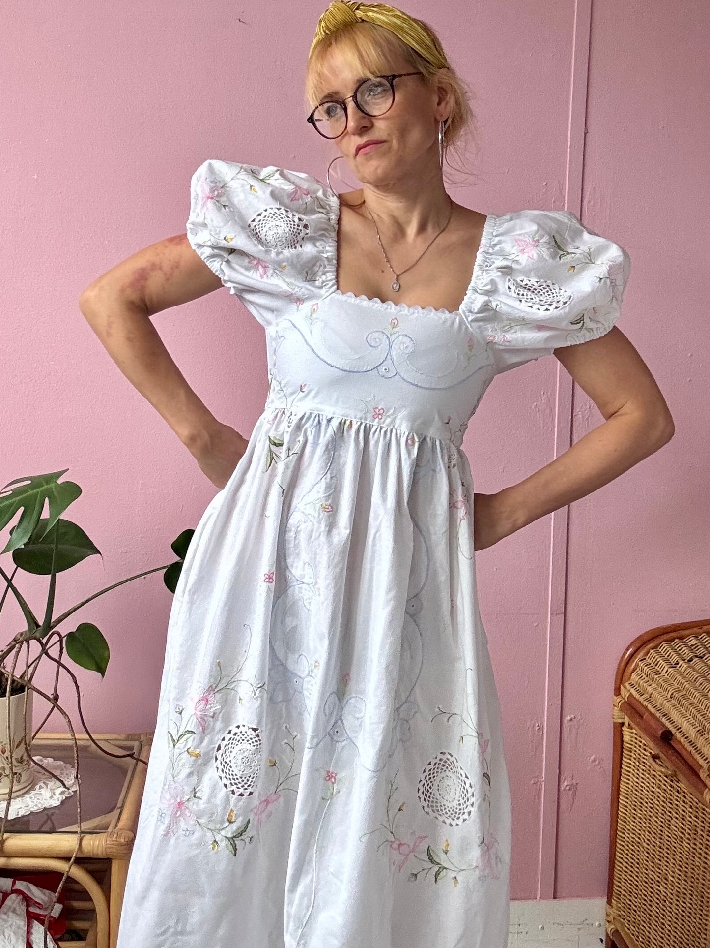 White maxi dress with floral embroidery and puffy sleeves