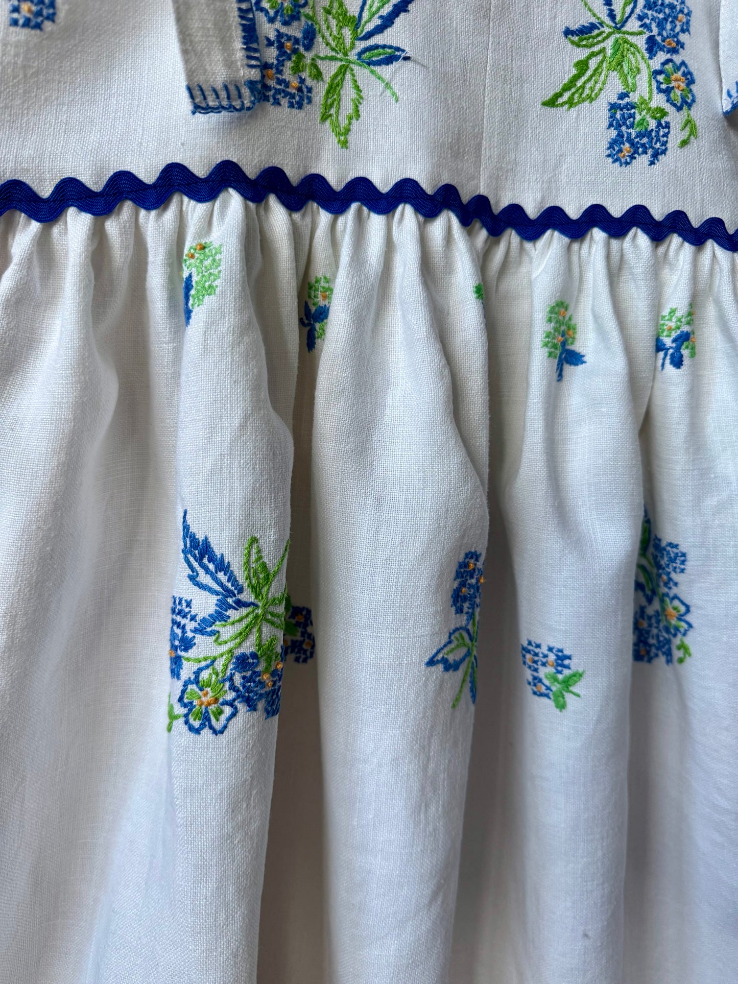 Linen  mini dress with blue floral embroidery