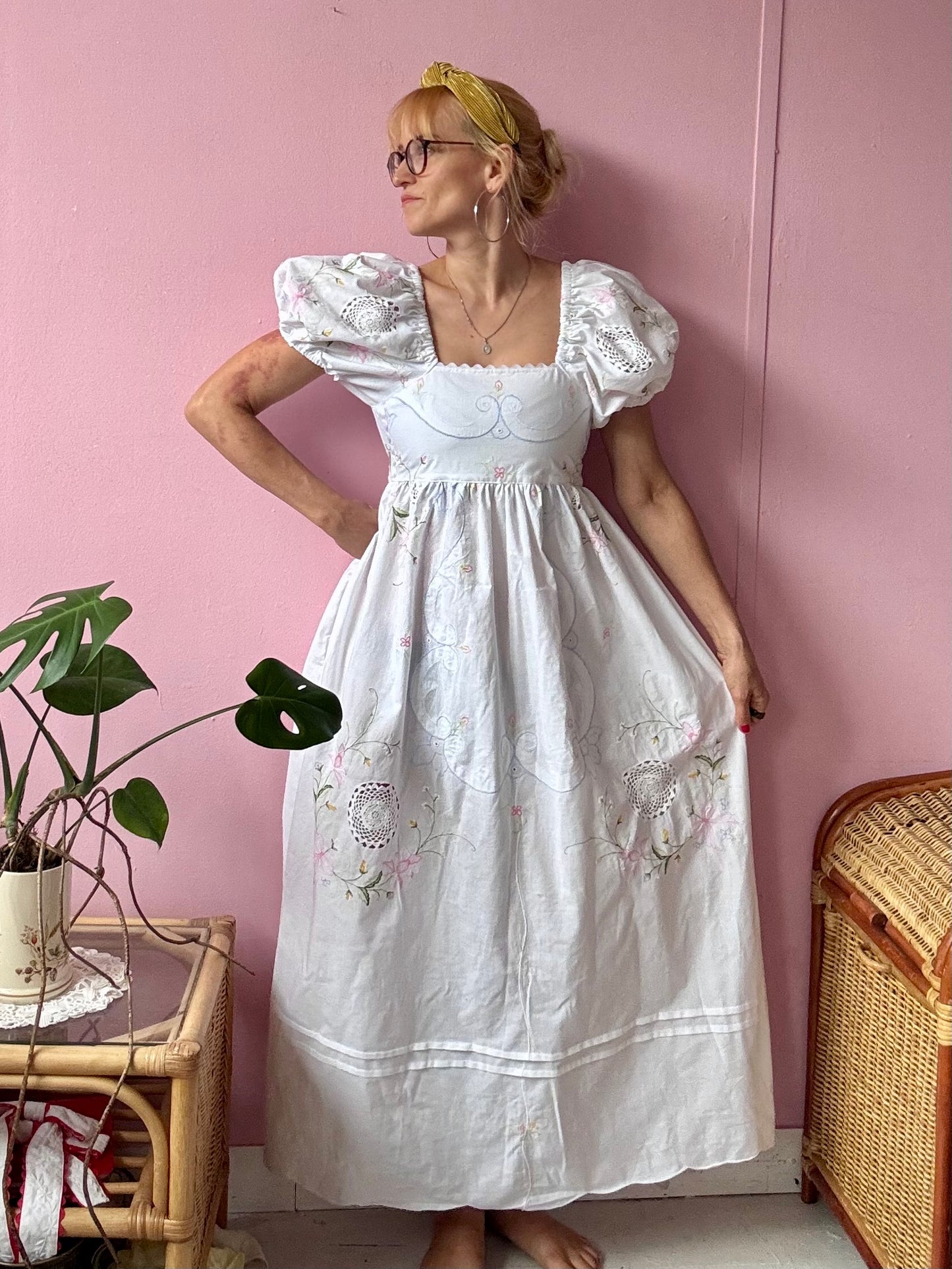 White maxi dress with floral embroidery and puffy sleeves