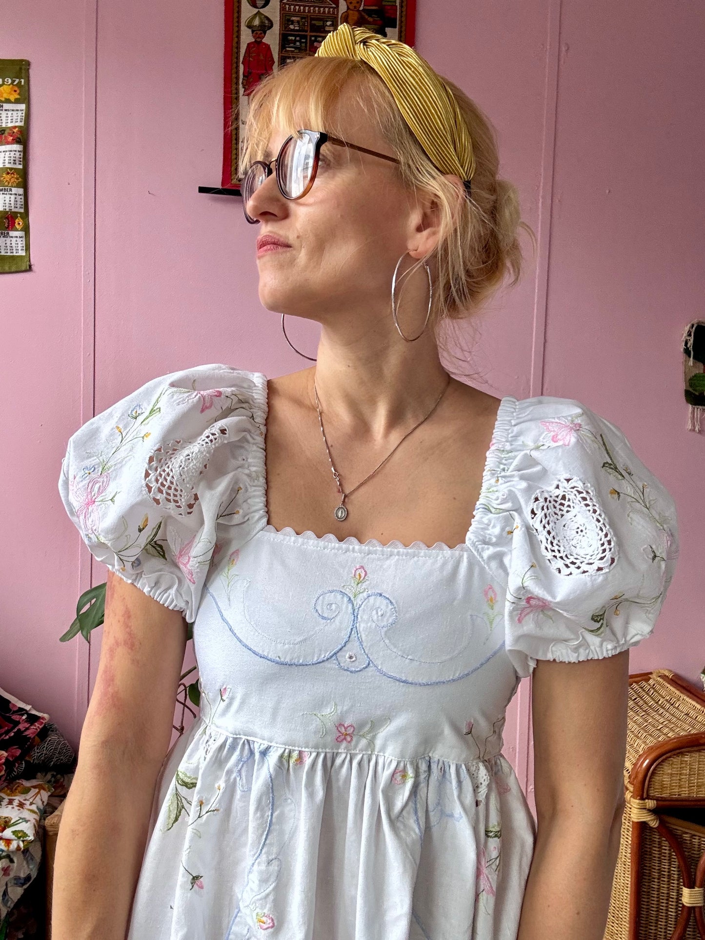 White maxi dress with floral embroidery and puffy sleeves