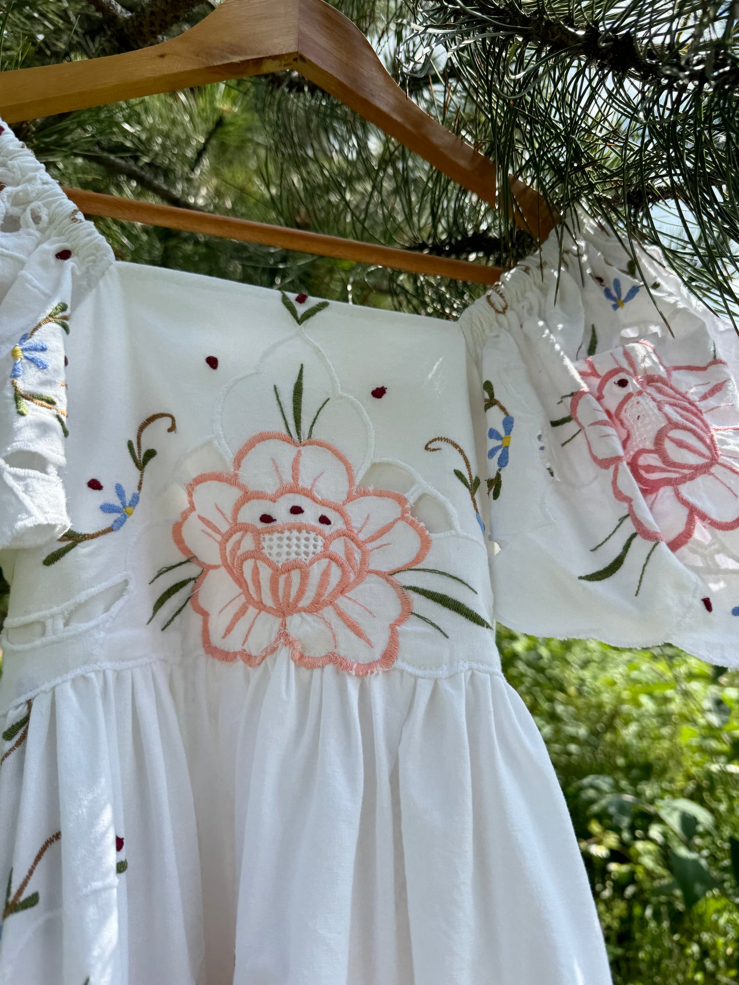 Short dress with floral cut out embroidery