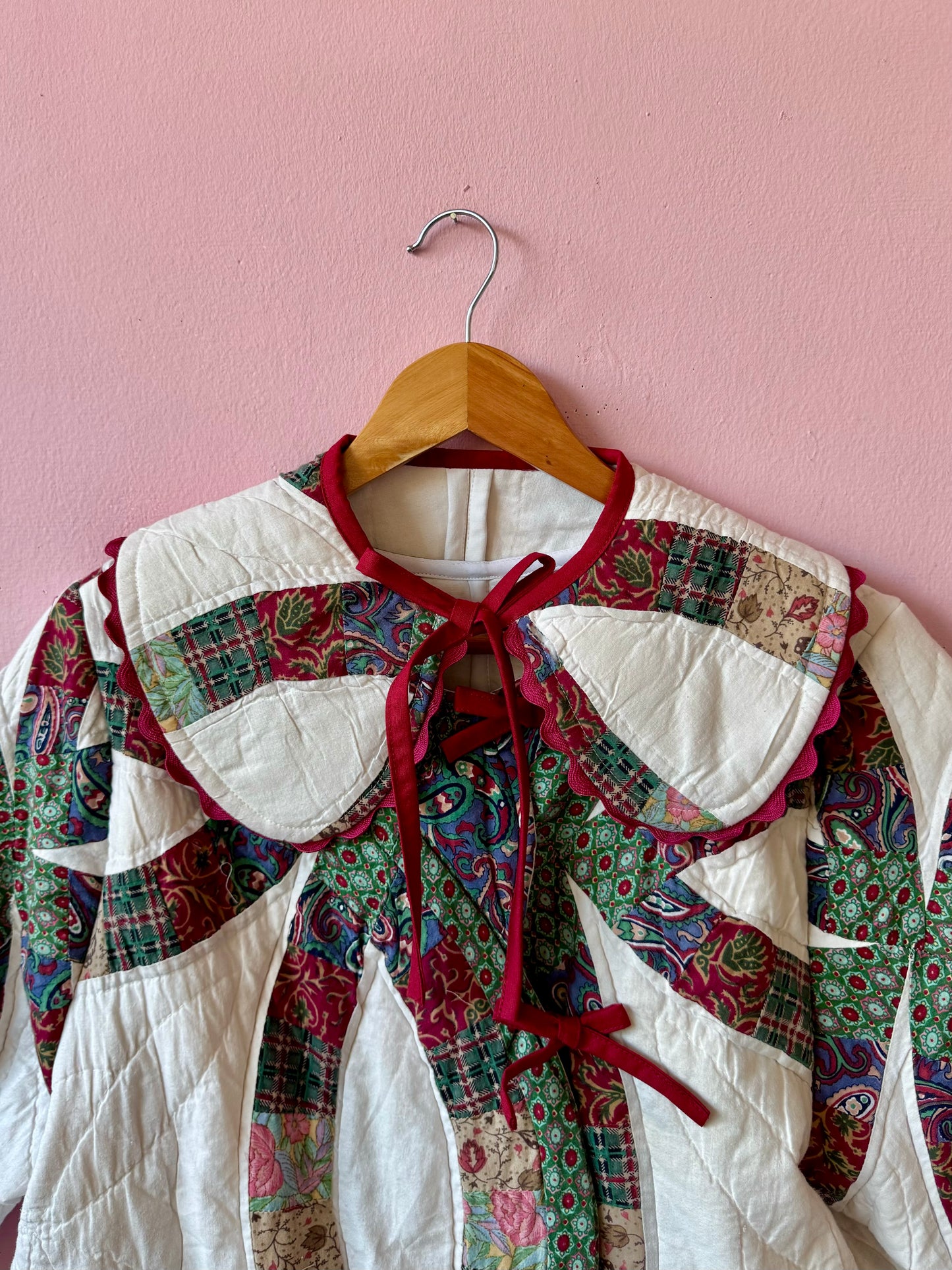 Patchwork jacket with burgundy ric rac and bows