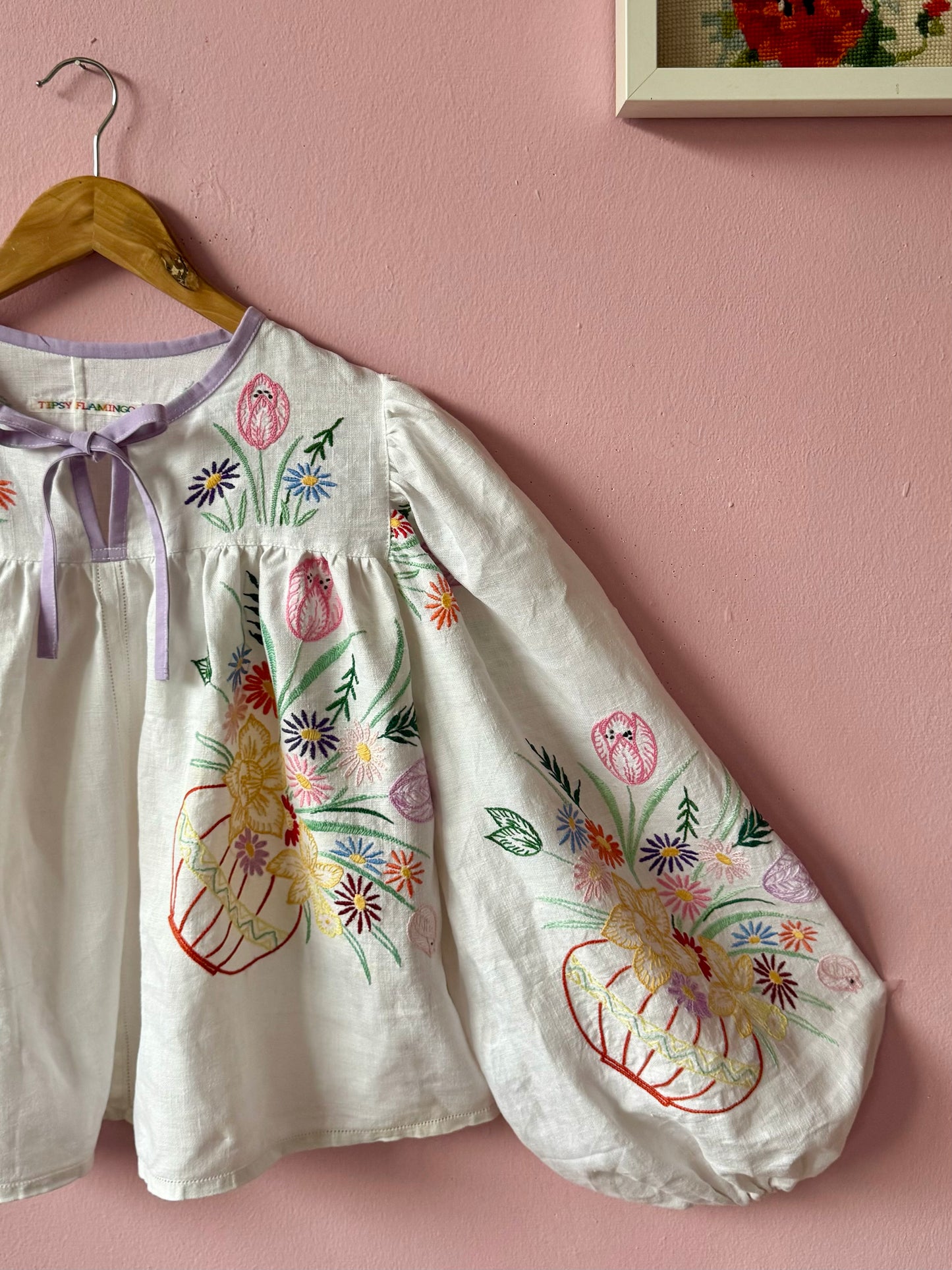 White linen blouse with baskets embroidery and lilac binding
