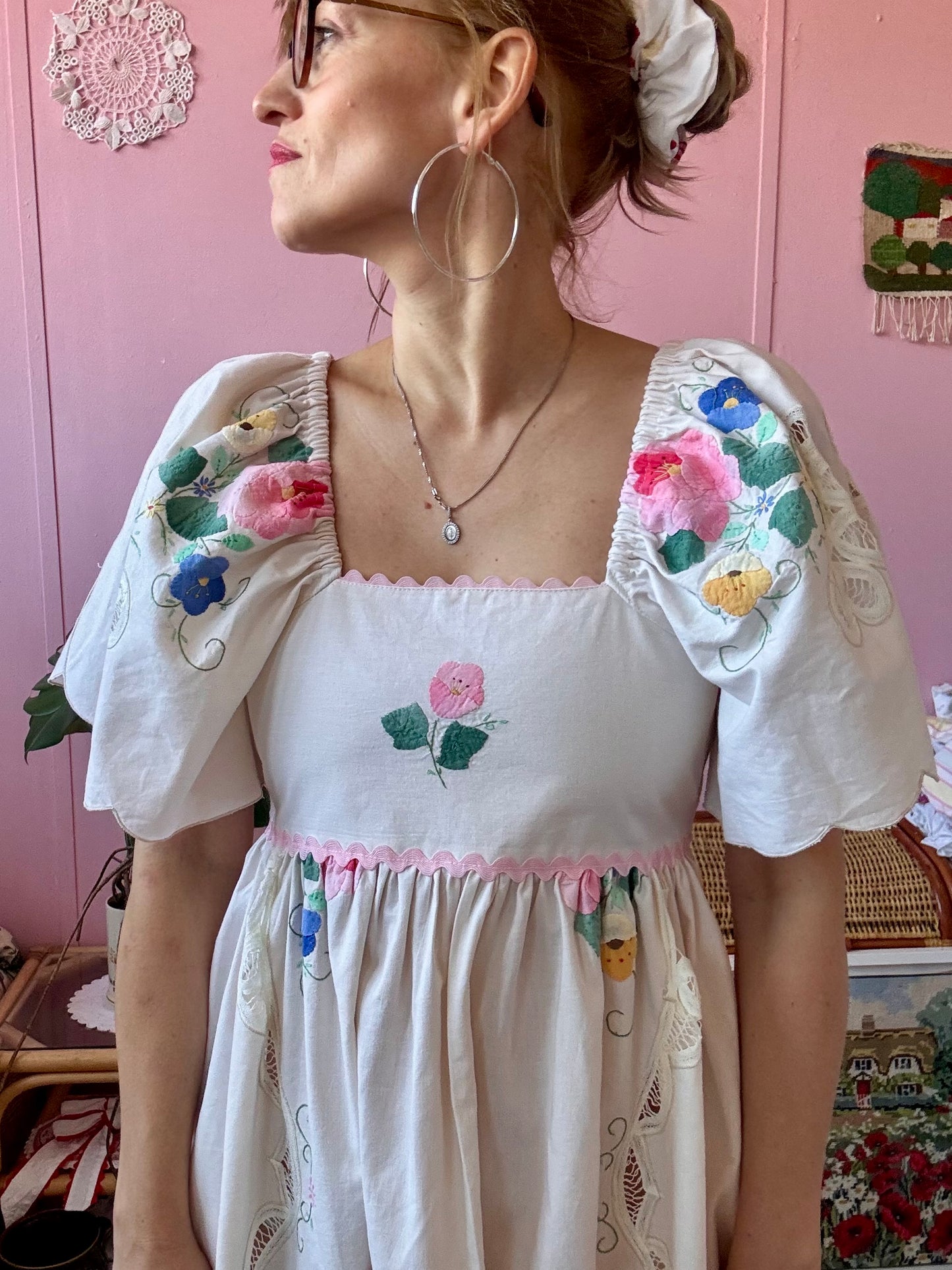 Cream maxi dress with floral appliqués